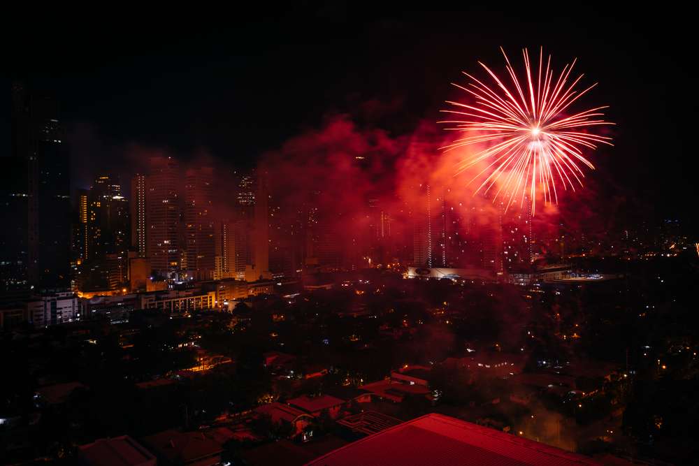 Chinese New Year fireworks over Makati at night, in Metro Manila, The Philippines.