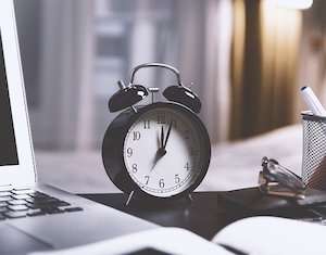 A classic analog clock face, symbolizing the importance of time and consistency in law firm blogging.